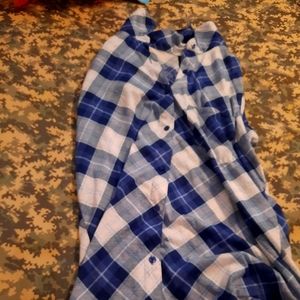 A nice jean skirt with a blue and white  button shirt